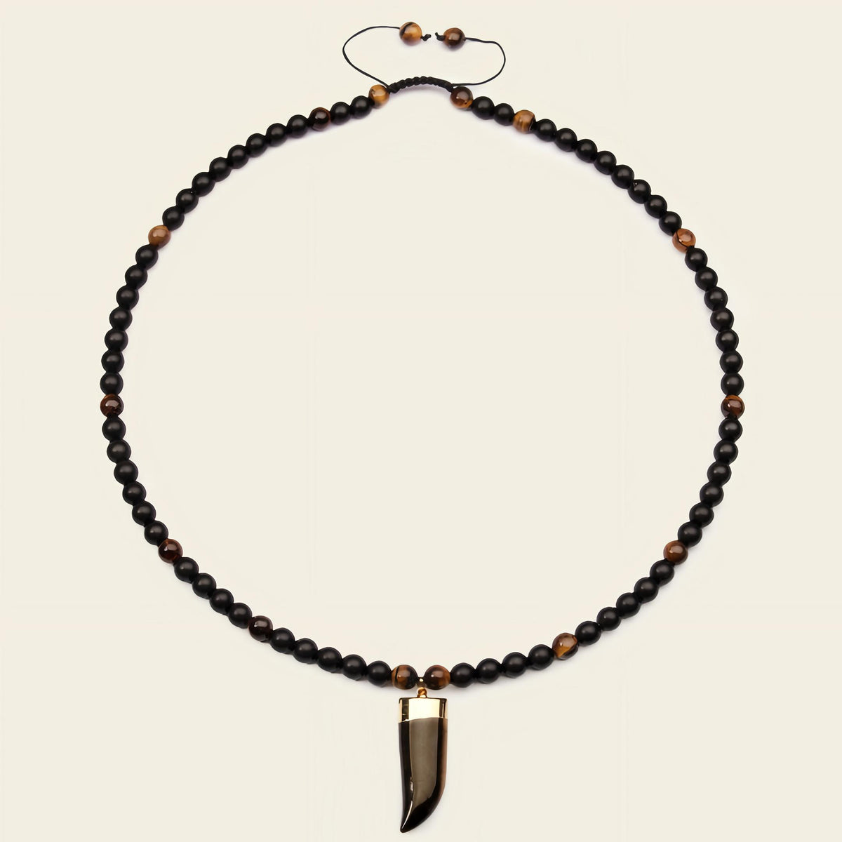 Talon Drift Necklace with dark round beads and a claw-shaped pendant