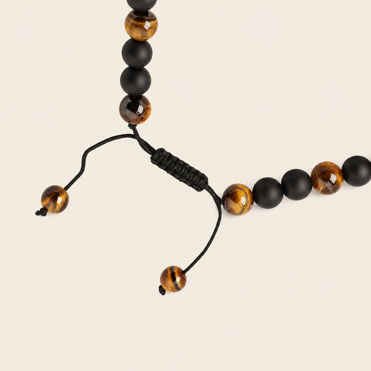 Talon Drift Necklace with dark round beads and a claw-shaped pendant