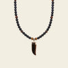 Talon Drift Necklace with dark round beads and a claw-shaped pendant