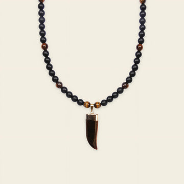 Talon Drift Necklace with dark round beads and a claw-shaped pendant