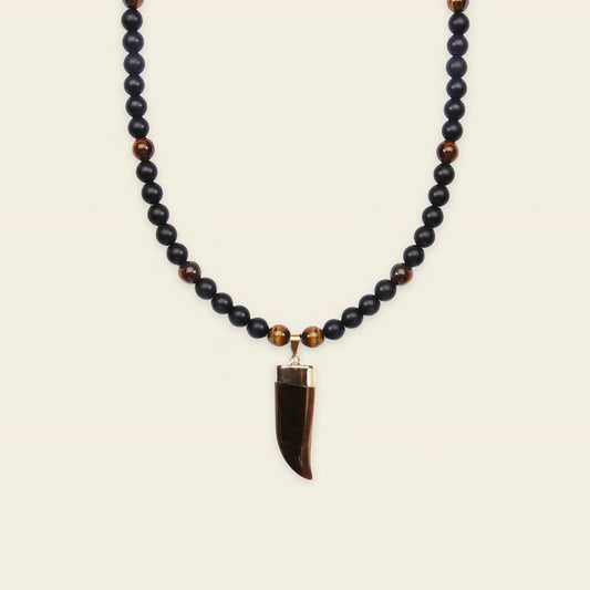 Talon Drift Necklace with dark round beads and a claw-shaped pendant