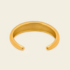 Tapered Arc Cuff with a smooth tapered open band in gold finish