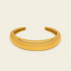 Tapered Arc Cuff with a smooth tapered open band in gold finish