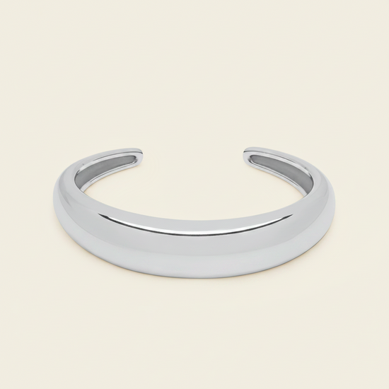 Tapered Arc Cuff with a smooth tapered open band in silver finish
