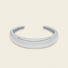 Tapered Arc Cuff with a smooth tapered open band in silver finish