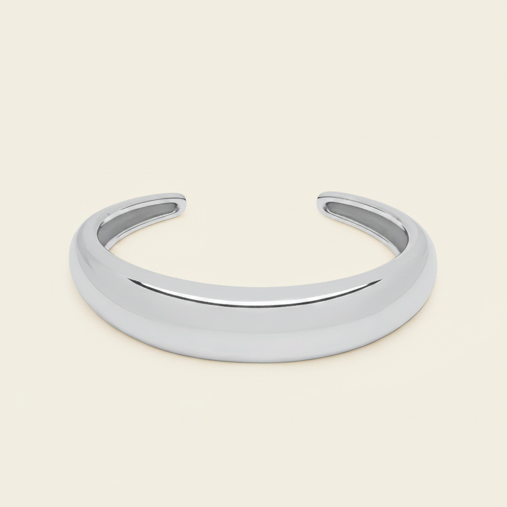 Tapered Arc Cuff with a smooth tapered open band in silver finish