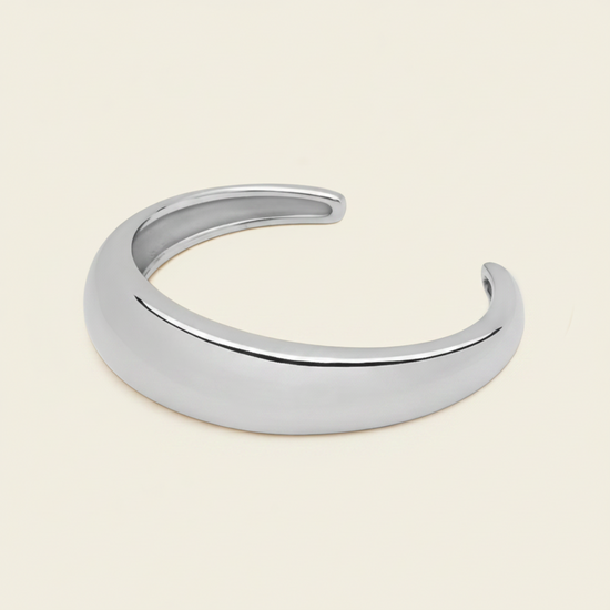 Tapered Arc Cuff with a smooth tapered open band in silver finish