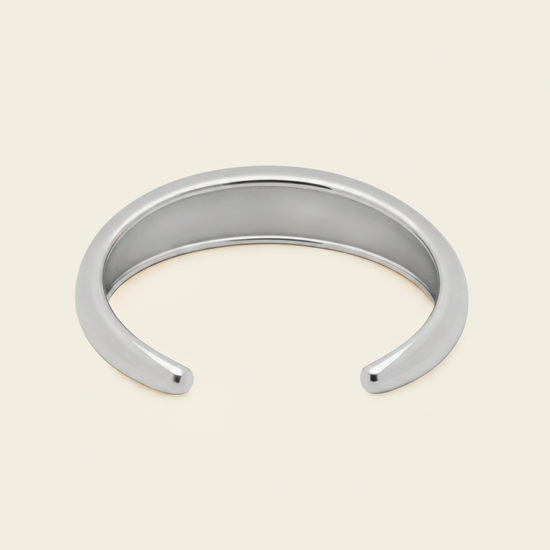 Tapered Arc Cuff with a smooth tapered open band in silver finish