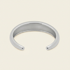 Tapered Arc Cuff with a smooth tapered open band in silver finish