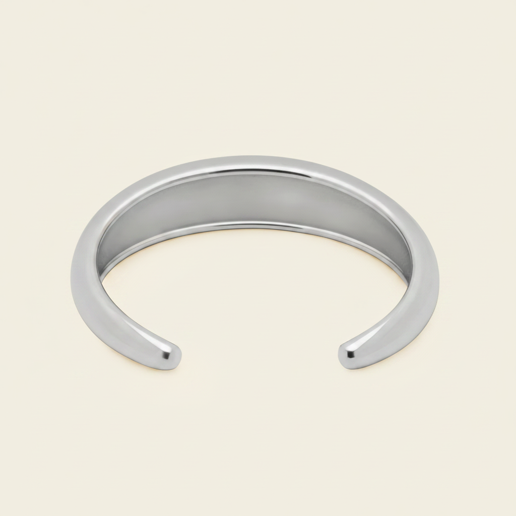 Tapered Arc Cuff with a smooth tapered open band in silver finish