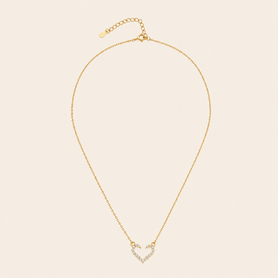 Tender Heart Necklace with an open heart pendant with clear accents in gold finish