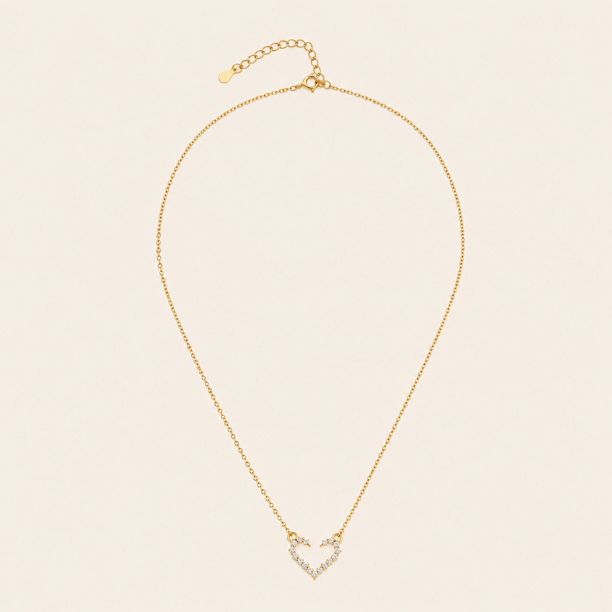 Tender Heart Necklace with an open heart pendant with clear accents in gold finish