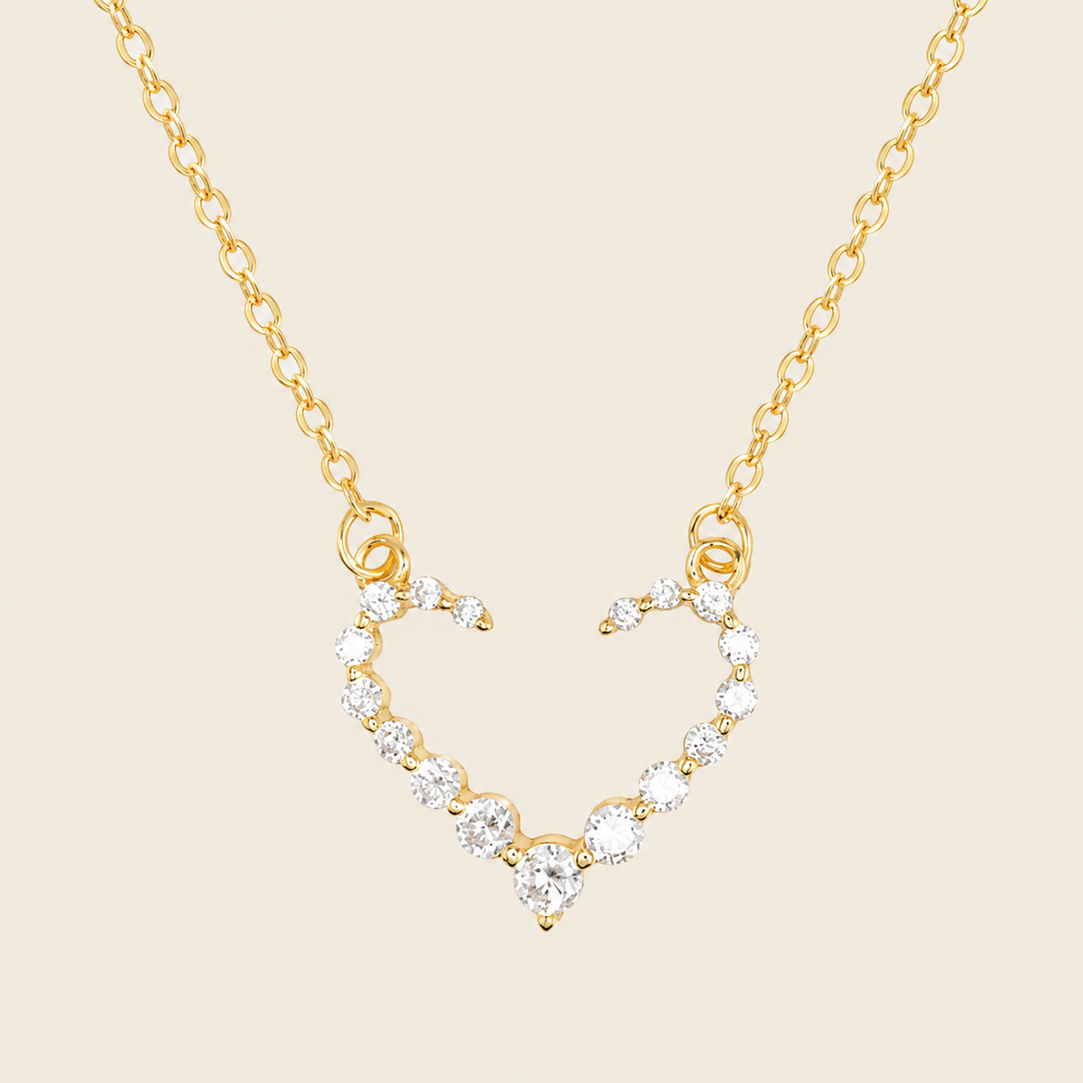 Tender Heart Necklace with an open heart pendant with clear accents in gold finish