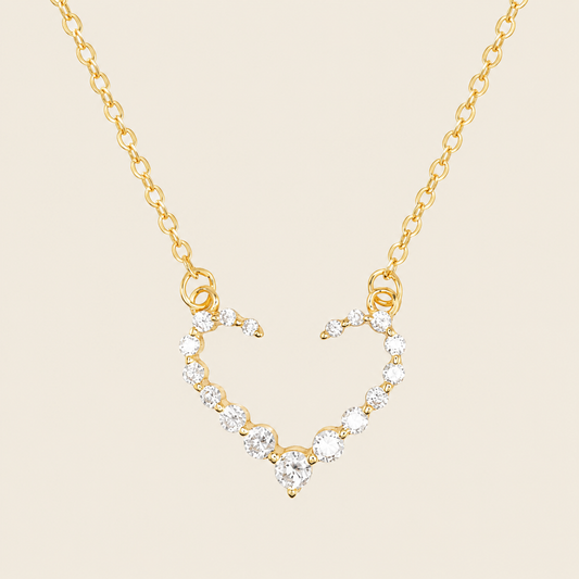 Tender Heart Necklace with an open heart pendant with clear accents in gold finish