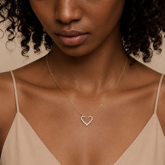 Tender Heart Necklace worn at the neckline in gold finish