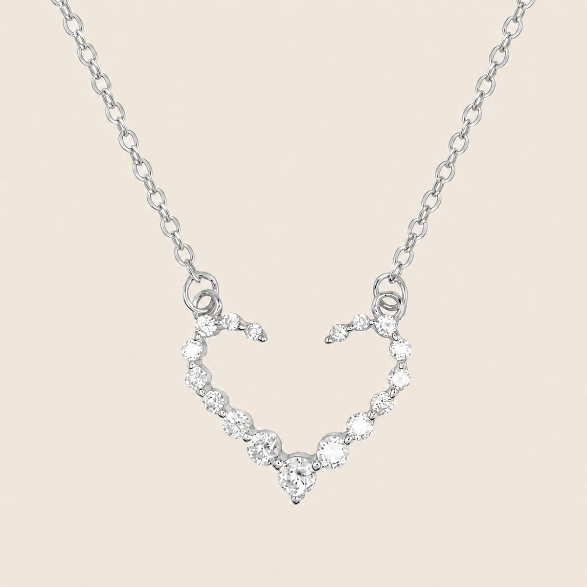 Tender Heart Necklace with an open heart pendant with clear accents in silver finish