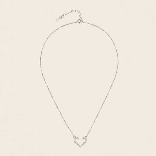 Tender Heart Necklace with an open heart pendant with clear accents in silver finish