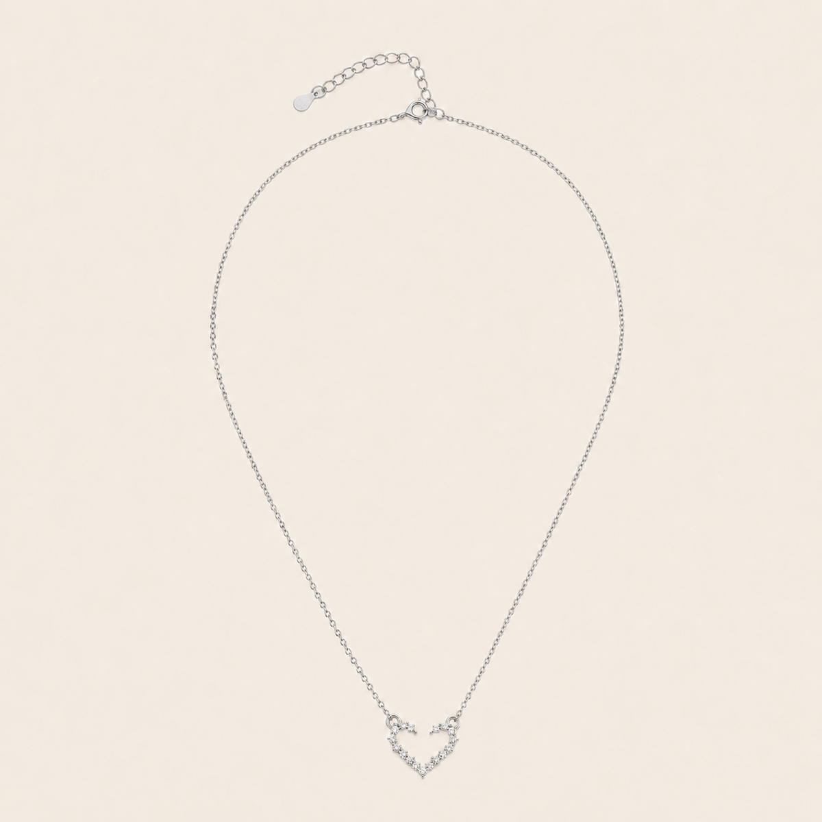 Tender Heart Necklace with an open heart pendant with clear accents in silver finish