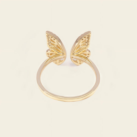 Tender Wing Ring with an open butterfly-wing design in gold finish