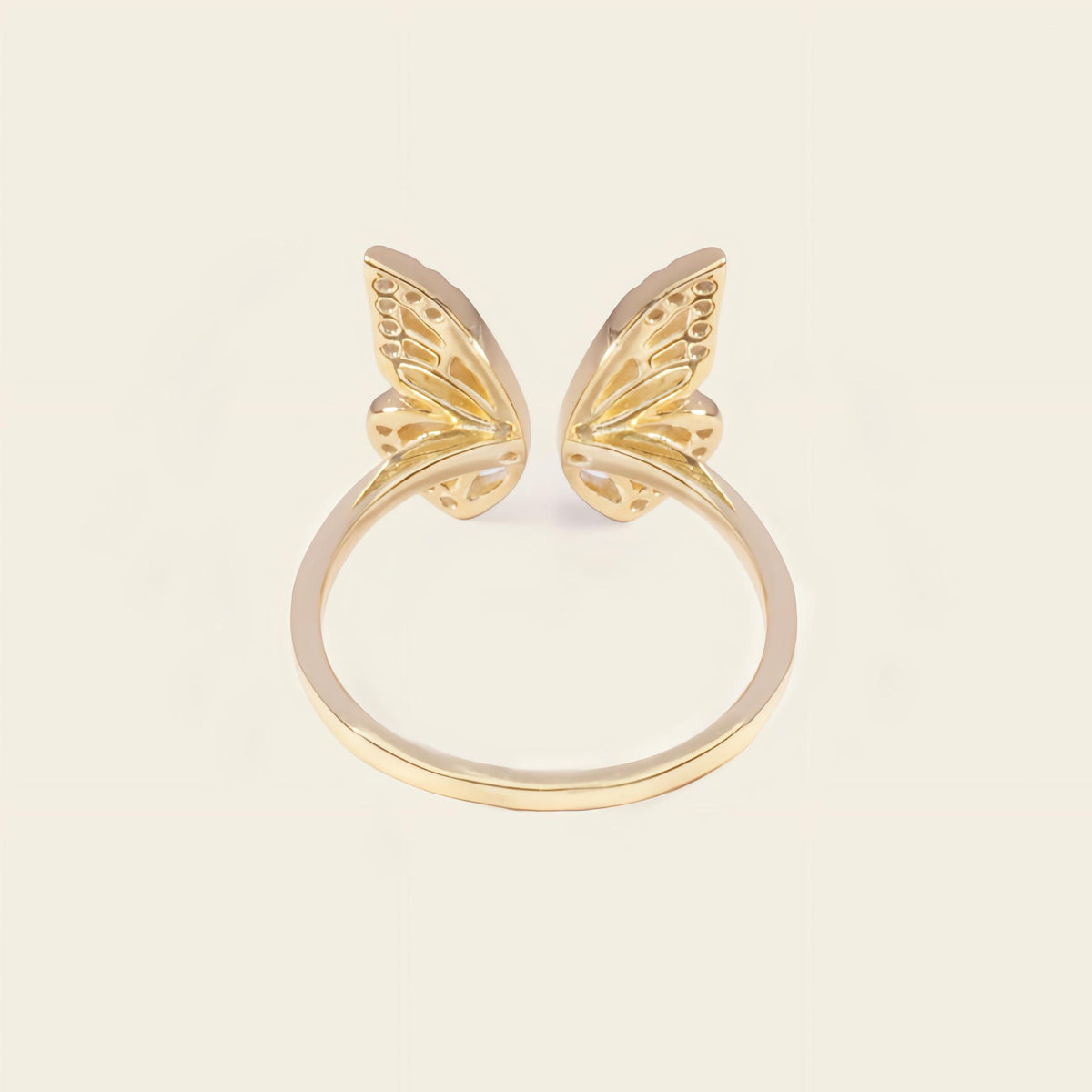 Tender Wing Ring with an open butterfly-wing design in gold finish