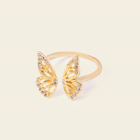 Tender Wing Ring with an open butterfly-wing design in gold finish