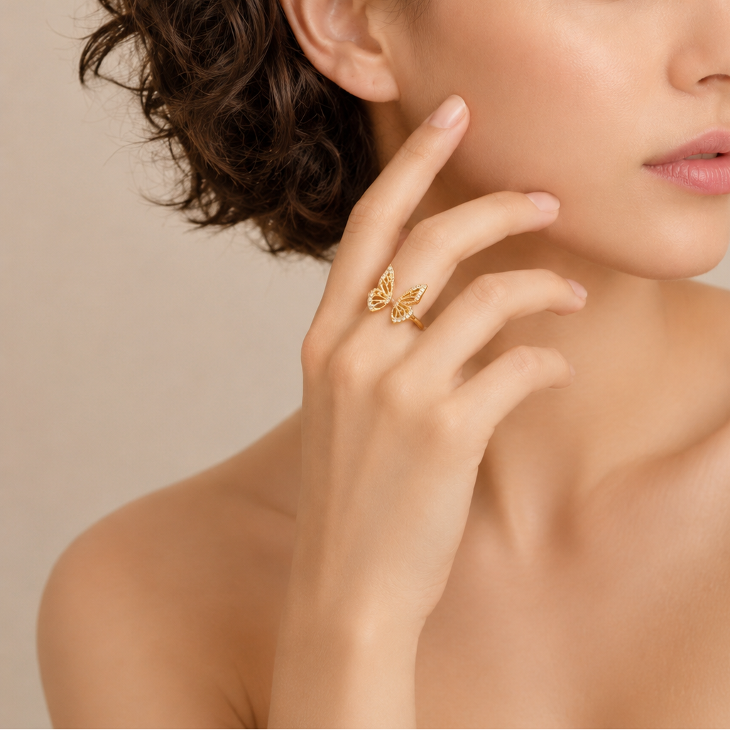 Tender Wing Ring worn on the hand in gold finish