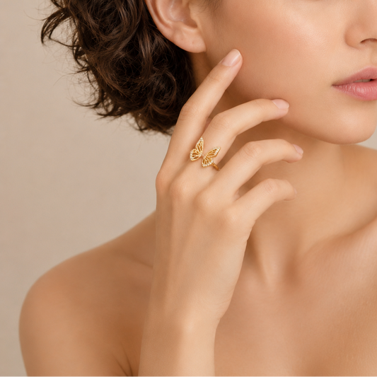 Tender Wing Ring worn on the hand in gold finish