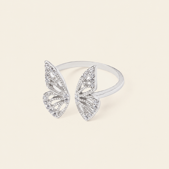 Tender Wing Ring with an open butterfly-wing design in silver finish