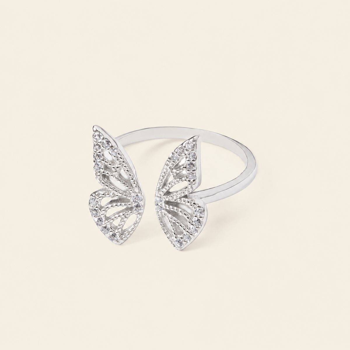 Tender Wing Ring with an open butterfly-wing design in silver finish