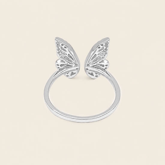 Tender Wing Ring with an open butterfly-wing design in silver finish