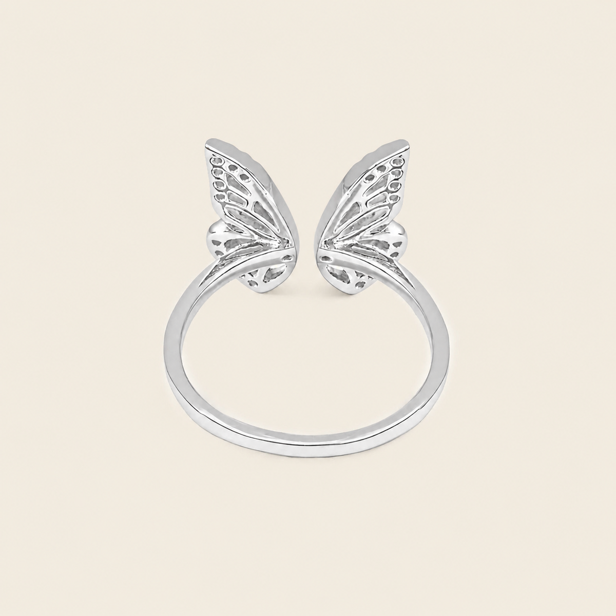Tender Wing Ring with an open butterfly-wing design in silver finish