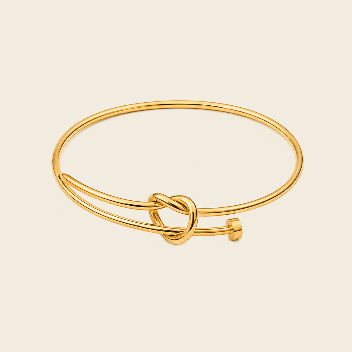 Tied Line Bracelet with a fine open band with a central knot in gold finish