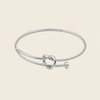 Tied Line Bracelet with a fine open band with a central knot in silver finish