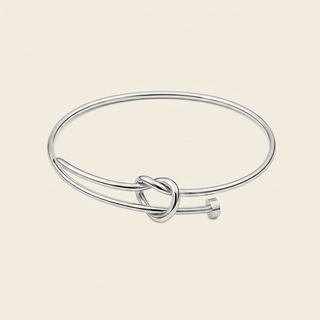 Tied Line Bracelet with a fine open band with a central knot in silver finish