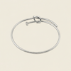 Tied Line Bracelet with a fine open band with a central knot in silver finish