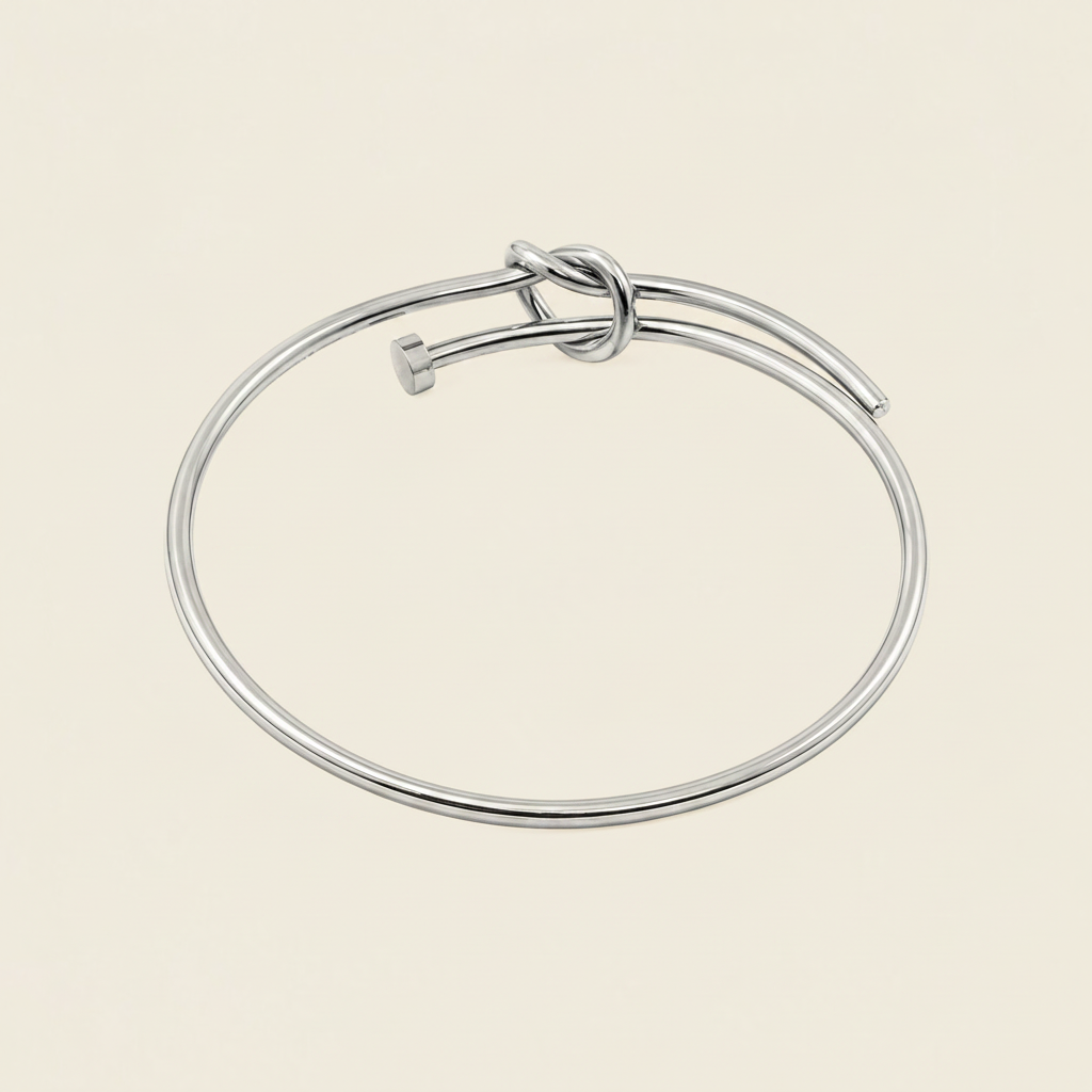 Tied Line Bracelet with a fine open band with a central knot in silver finish