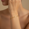Trace Link Bracelet worn on the wrist in gold finish