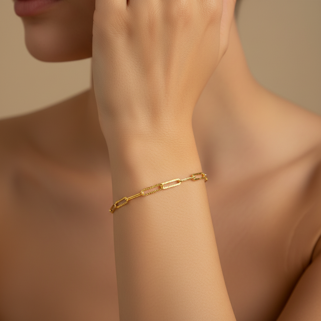 Trace Link Bracelet worn on the wrist in gold finish