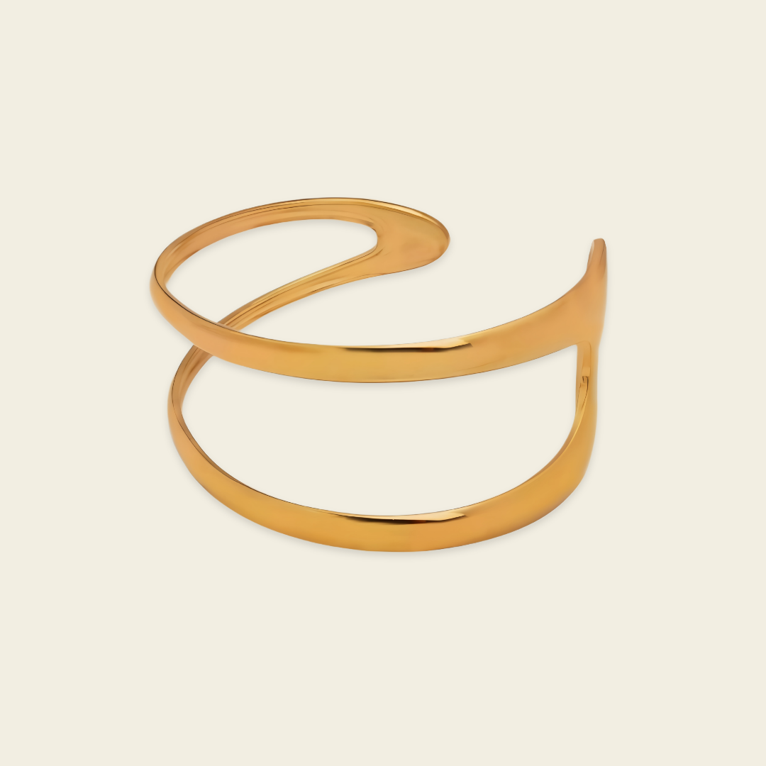 Twin Arc Cuff with two sweeping open bands and sculptural ends in gold finish