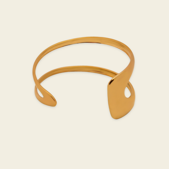 Twin Arc Cuff with two sweeping open bands and sculptural ends in gold finish