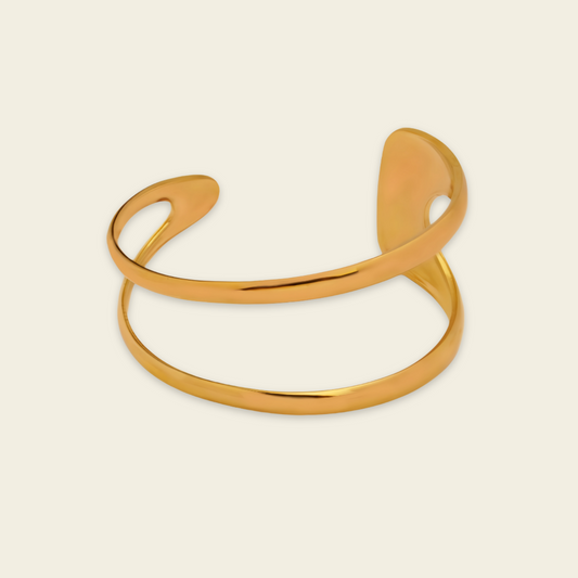 Twin Arc Cuff with two sweeping open bands and sculptural ends in gold finish