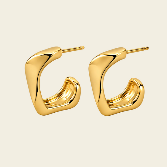 Twisted Ribbon Earrings with polished curved ribbon-shaped hoops in gold finish