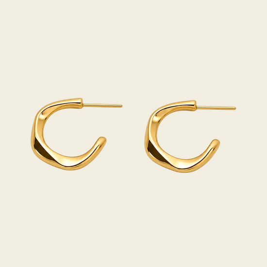 Twisted Ribbon Earrings with polished curved ribbon-shaped hoops in gold finish