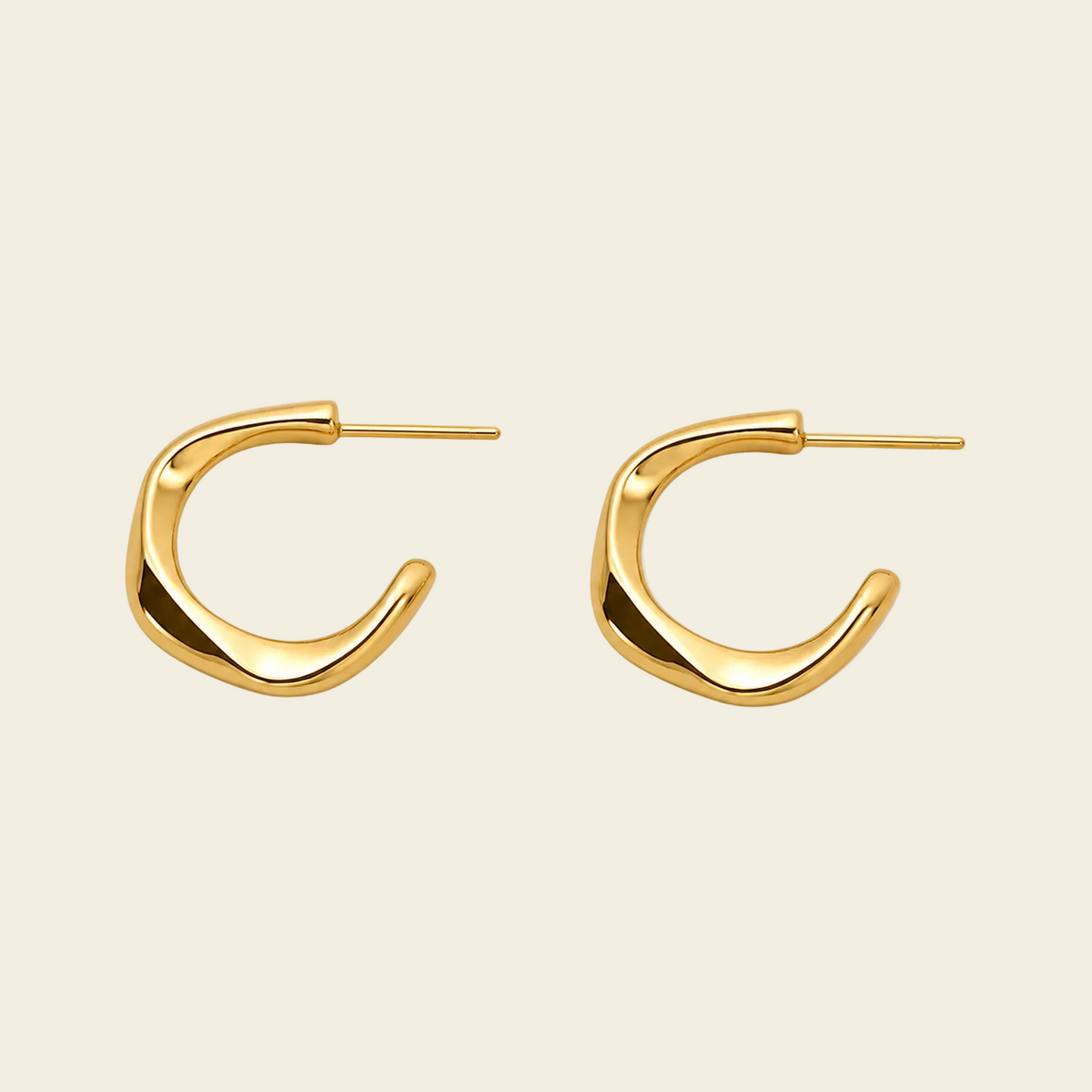 Twisted Ribbon Earrings with polished curved ribbon-shaped hoops in gold finish