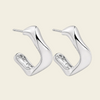 Twisted Ribbon Earrings with polished curved ribbon-shaped hoops in silver finish