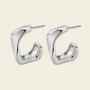 Twisted Ribbon Earrings with polished curved ribbon-shaped hoops in silver finish