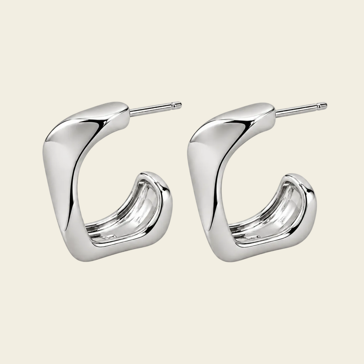 Twisted Ribbon Earrings with polished curved ribbon-shaped hoops in silver finish