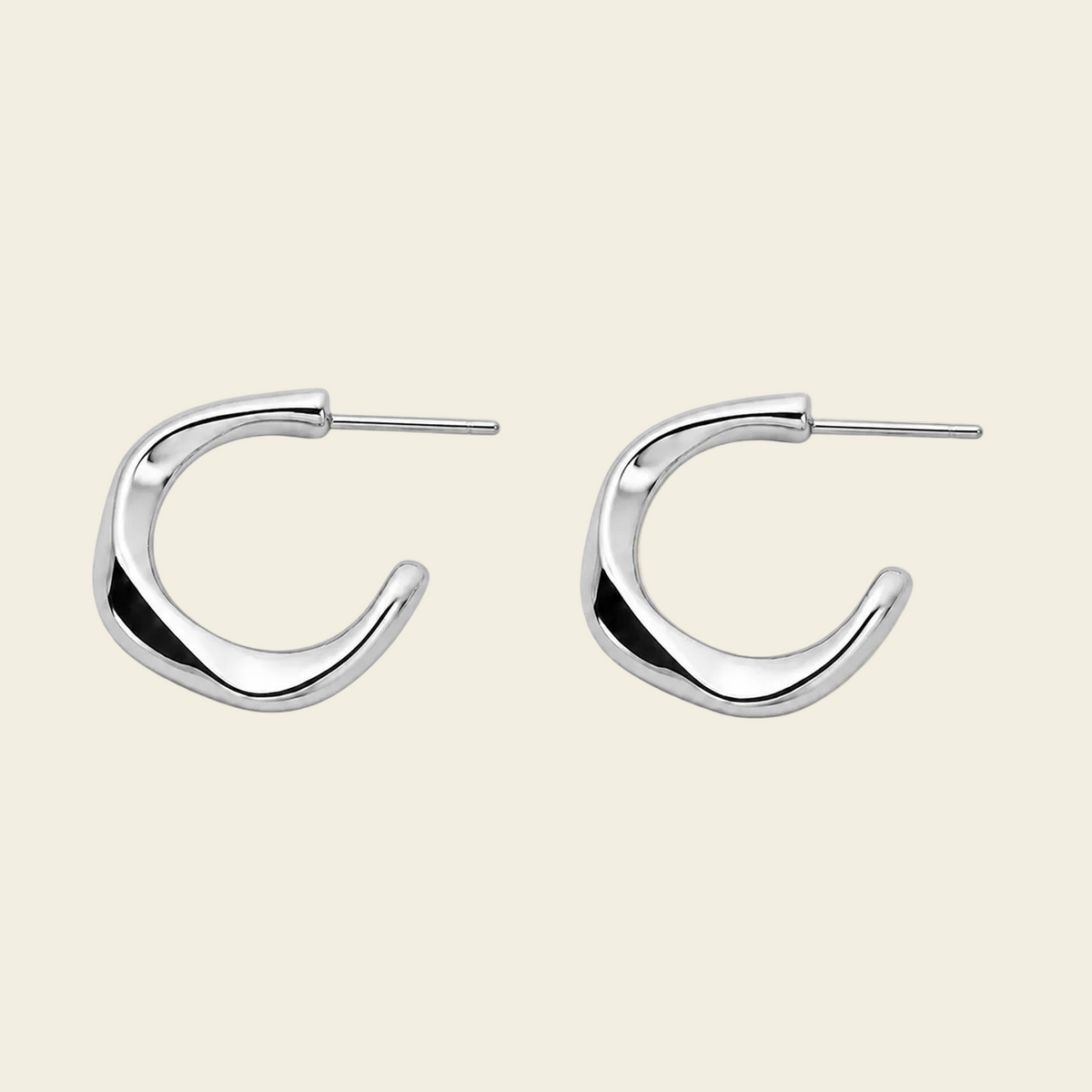 Twisted Ribbon Earrings with polished curved ribbon-shaped hoops in silver finish