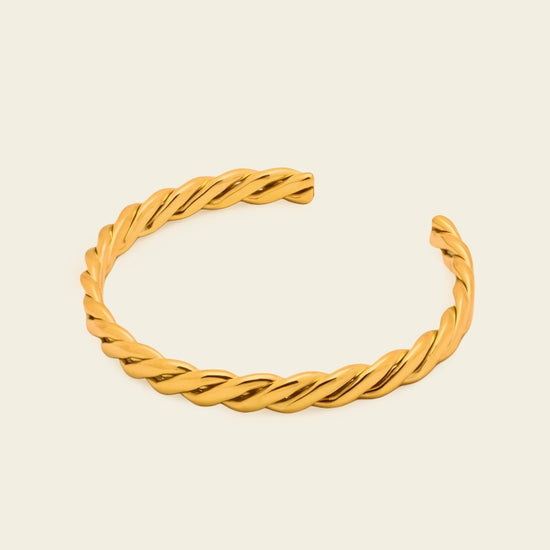 Twisted Strand Cuff with a twisted rope-shaped open band in gold finish