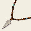 Vector Calm Necklace with brown stone beads and a pointed metal pendant